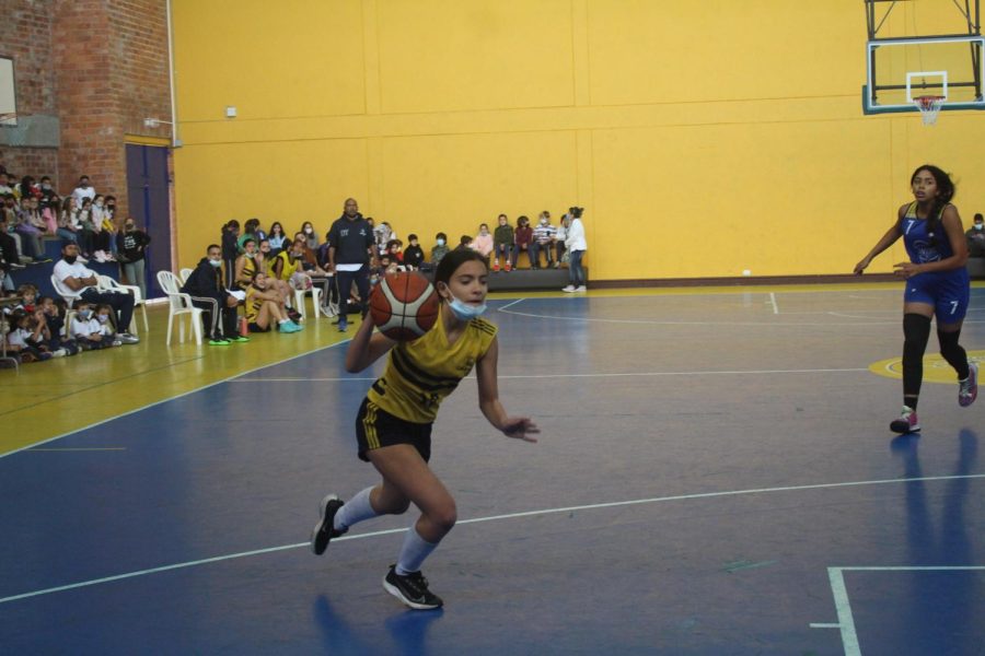 TCS Basketball player drives to the basket in a game a HS Copa Columbus on March 11.