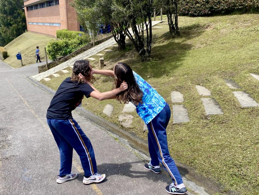 Two Elementary students grapple during recess. One common post-pandemic behavior among students is rough play. 