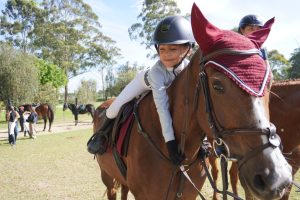 As Martina Torres, a 2nd-grade student from TCS, prepared to enter the arena for the show jumping competition, she passionately expressed her affection for the horse. “I felt very happy and excited because it was my first time competing in 50 cm and because I was riding my favorite horse, Hidalgo,” Torres said.