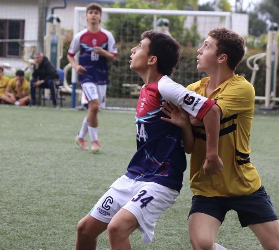 A TCS defender challenges an opponent from Cumbres during the futbal final of  Copa Montessori on September 23.  Columbus won the match 1-0. 