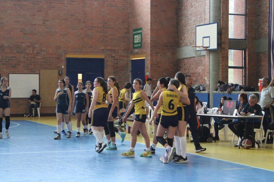 TCS students congratulate each other after a game.