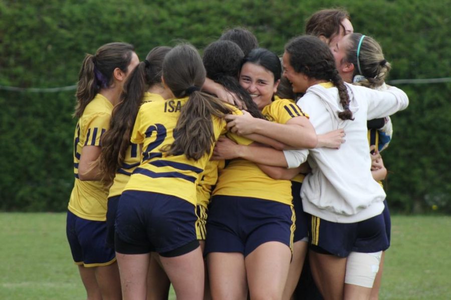 The Girls futbol team celebrates victory after winning against Colegio Cumbres on penalties in the semifinals.