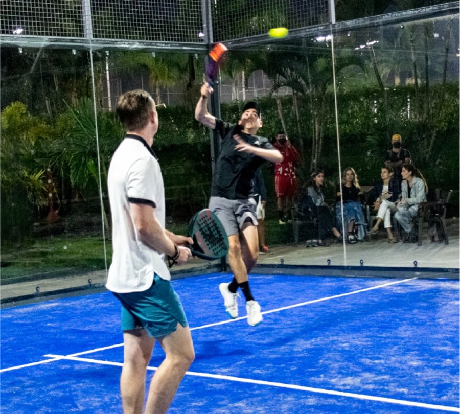 Pablo Arango, Grade 11,  jumps to reach the ball while playing in a padel tournament at Club Campestre on May 10. 