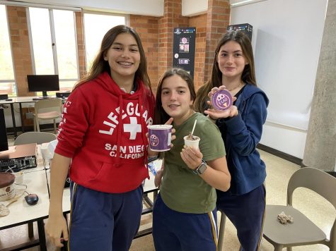 S. Galeano, A. Niehaus, and _ pose with their ice cream project